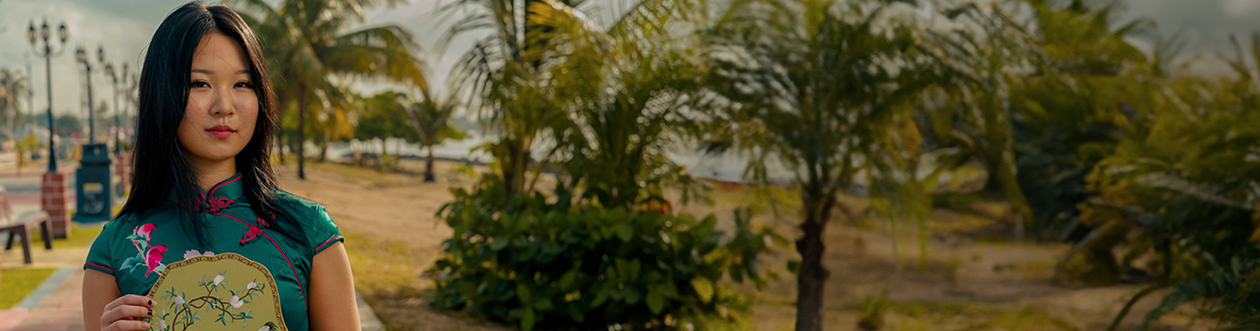chinese-woman-standing-in-park-banner